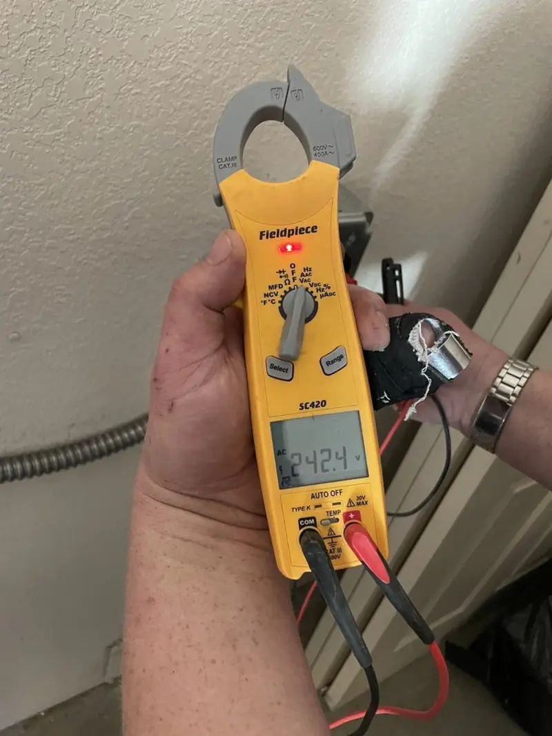 Voltage testing with clamp meter during Electrical Installation Services in Sunrise